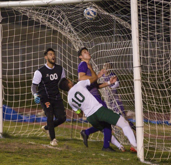 Lemoore's Diego Nunes scored this first half goal against Porterville Thursday night in Tiger Stadium. The Tigers' leading scorer, score twice but injured his hamstring late in the game.